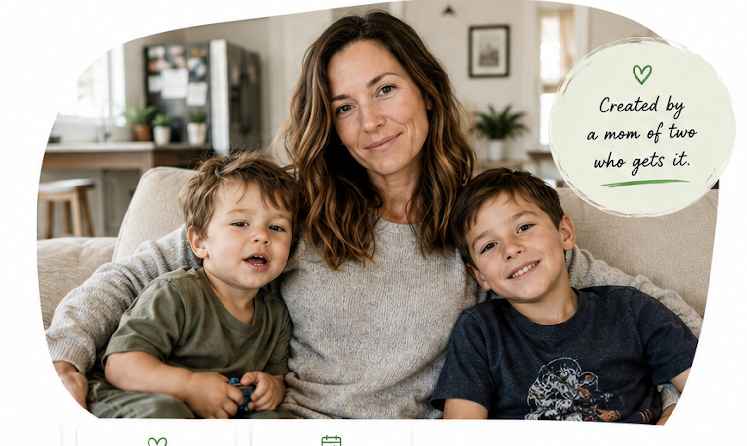 Emily at home on the sofa with her two young sons in a bright, lived-in living room.